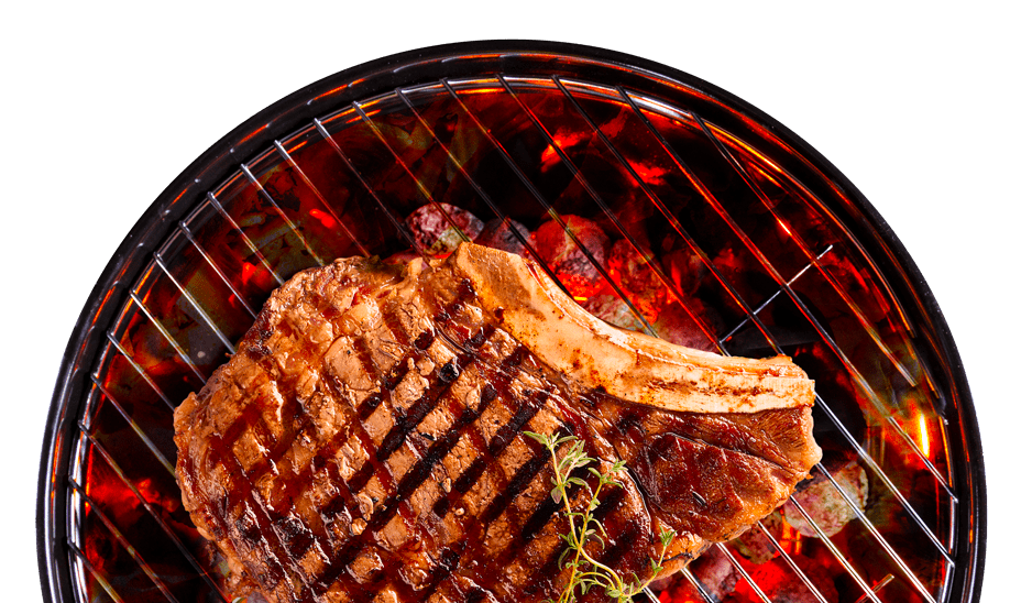 Un Rib steak grille sur un BBQ au charbon de bois